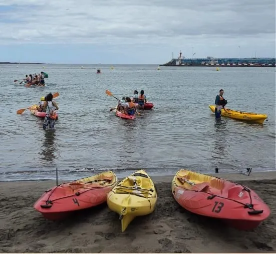 Participants kayaking in the shallows at Los Cristianos beach